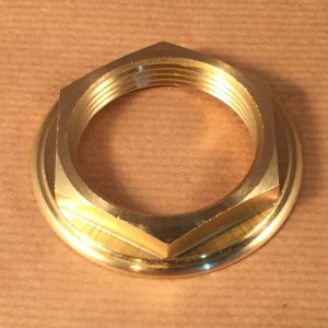 Brass locknut for Post-WW2 Crane lavatory valve bodies that attach to a metal spout