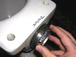 Step 1: Loosen the locknut with a large pair of adjustable pliers and back it off until it is on the last couple of threads.