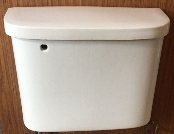 1911 Vintage rounded toilet tank, white in color