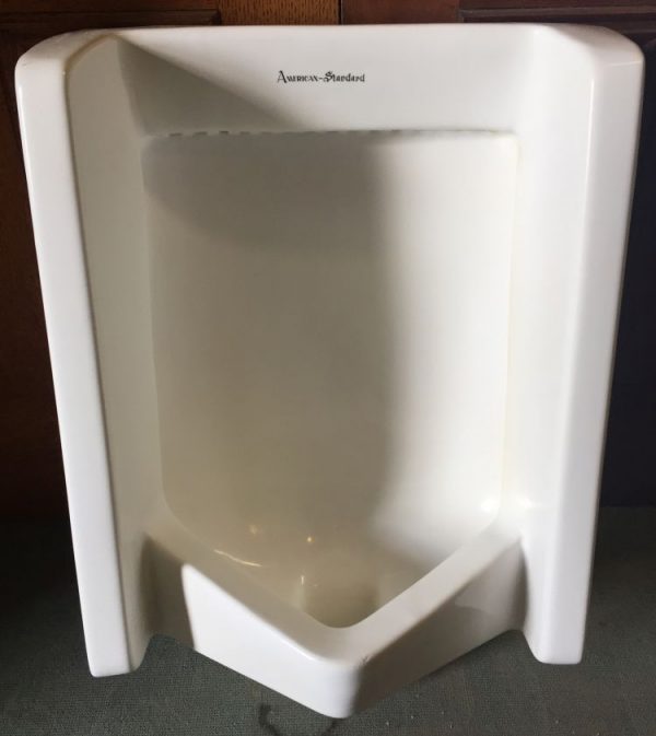Front view of 1960's standard wall hung urinal prop rental