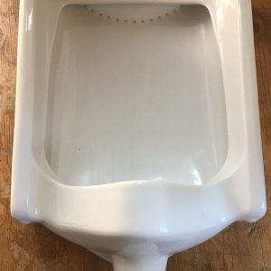 1988 Crane wall mount urinal, white is the color