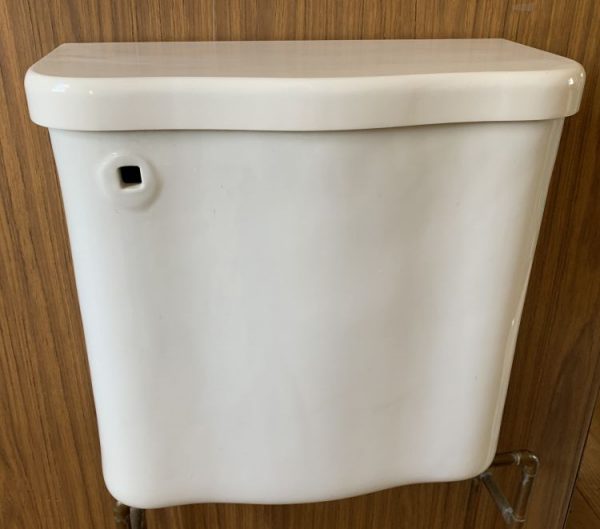 Serpentine antique toilet tank, color is old white, lid is off color
