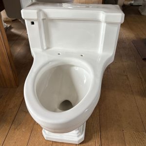 Standard one piece elongated toilet