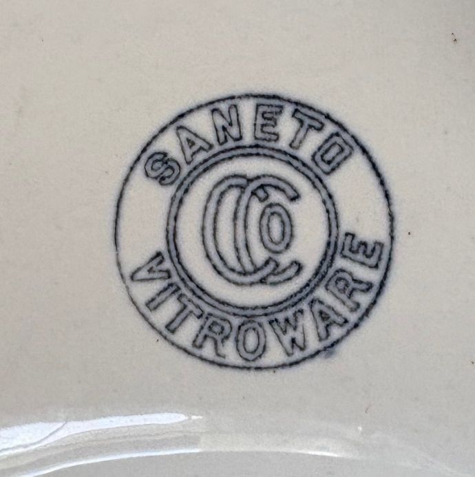 logo on 1910 Crane Saneto beaded rim toilet bowl
